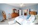 Inviting main bedroom with a comfortable bed, ensuite bathroom, and ample closet space for organized living at 7283 Sw 94Th Ave, Ocala, FL 34481