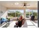Cozy outdoor patio with comfortable furniture, a ceiling fan, and a view of the backyard at 7283 Sw 94Th Ave, Ocala, FL 34481