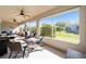 Spacious screened patio with multiple seating areas and views of the backyard, perfect for entertaining guests at 7283 Sw 94Th Ave, Ocala, FL 34481
