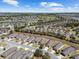 A scenic aerial view shows a community of single-Gathering homes with access to parks, lakes, and golf courses at 7665 Sw 96Th Avenue Rd, Ocala, FL 34481