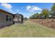 Manicured backyard featuring verdant lawn, showcasing the home's outdoor space and screened-in lanai at 7665 Sw 96Th Avenue Rd, Ocala, FL 34481