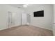 Bedroom featuring neutral carpet and an ensuite bathroom at 7665 Sw 96Th Avenue Rd, Ocala, FL 34481