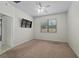 Bedroom featuring neutral carpet and a TV at 7665 Sw 96Th Avenue Rd, Ocala, FL 34481