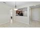 Light-filled dining room with tile flooring and view of the kitchen area at 7665 Sw 96Th Avenue Rd, Ocala, FL 34481
