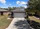 Charming single-story home with well-maintained landscaping and a two-car garage at 7665 Sw 96Th Avenue Rd, Ocala, FL 34481
