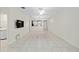 Bright living room features tile flooring, neutral paint, and an open floor plan to the kitchen at 7665 Sw 96Th Avenue Rd, Ocala, FL 34481