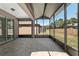 Expansive screened-in patio with ample space, offering a seamless transition to the outdoors at 7665 Sw 96Th Avenue Rd, Ocala, FL 34481