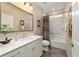 Bathroom with vanity, framed mirror, and tub-shower combo with tropical curtain at 8344 Sw 79Th Cir, Ocala, FL 34476
