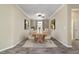 Elegant dining room with a long wooden table and comfortable chairs, ideal for Gathering gatherings and entertaining guests at 8344 Sw 79Th Cir, Ocala, FL 34476