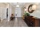 Inviting foyer with wood-look tile flooring, crown molding, and stylish decor at 8344 Sw 79Th Cir, Ocala, FL 34476