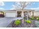 Welcoming single-story home featuring a paver driveway, two-car garage, and beautifully landscaped front yard at 8344 Sw 79Th Cir, Ocala, FL 34476