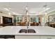 This kitchen island features a stainless sink and white quartz countertop, perfect for entertaining at 8344 Sw 79Th Cir, Ocala, FL 34476