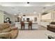 Bright kitchen features white cabinetry, quartz countertops, pendant lighting, and breakfast bar with seating at 8344 Sw 79Th Cir, Ocala, FL 34476