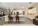 Beautiful kitchen with white cabinets, island with quartz countertop, and pendant lighting at 8344 Sw 79Th Cir, Ocala, FL 34476