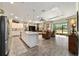 Bright and spacious living area with a large island, tile floors, and open concept at 8344 Sw 79Th Cir, Ocala, FL 34476