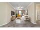 Modern living room with sleek furniture, a large TV, and a cozy seating arrangement at 8344 Sw 79Th Cir, Ocala, FL 34476