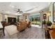 Spacious living room boasting tile floors, ample seating, and sliding glass doors at 8344 Sw 79Th Cir, Ocala, FL 34476