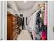 Walk-in closet with ample hanging space and shelving for storage at 8344 Sw 79Th Cir, Ocala, FL 34476