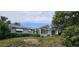 View of home backyard with a screened-in porch at 8449 Sw 106Th Pl, Ocala, FL 34481