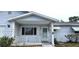 Charming front porch featuring a white picket railing, offering a welcoming entrance to the home at 8449 Sw 106Th Pl, Ocala, FL 34481