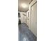 Well-lit laundry room with blue flooring, ample storage, and laundry facilities at 8449 Sw 106Th Pl, Ocala, FL 34481