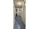 Functional laundry area with blue tile flooring, utility sink, and storage cabinets at 8449 Sw 106Th Pl, Ocala, FL 34481