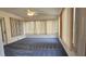 Cozy sun room with lots of natural light featuring neutral colors, carpet and many windows with blinds at 8449 Sw 106Th Pl, Ocala, FL 34481