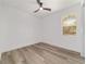 Bedroom showcasing a ceiling fan, wood-look floors, and bright natural light at 8850 Sw 125Th Ter, Dunnellon, FL 34432