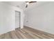 Clean bedroom showcases wood-look flooring, a closet, and fresh white walls for a modern aesthetic at 8850 Sw 125Th Ter, Dunnellon, FL 34432
