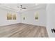 Bright primary bedroom with tray ceiling and large windows at 8850 Sw 125Th Ter, Dunnellon, FL 34432