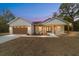 Charming single-story home with a welcoming front porch and well-manicured lawn at 8850 Sw 125Th Ter, Dunnellon, FL 34432