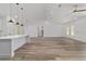 Bright living area features a modern kitchen island and glass doors, creating an ideal space for entertaining and relaxing at 8850 Sw 125Th Ter, Dunnellon, FL 34432