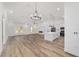 Open-concept living space with fireplace and kitchen view at 8850 Sw 125Th Ter, Dunnellon, FL 34432
