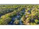 Aerial view of homes on tree lined street at 8869 Sw 194Th Ct, Dunnellon, FL 34432