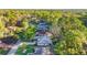 Beautiful aerial view of homes in a serene neighborhood surrounded by lush greenery and mature trees at 8869 Sw 194Th Ct, Dunnellon, FL 34432