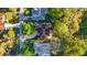 An aerial shot of the property highlights mature trees and well-manicured landscaping at 8869 Sw 194Th Ct, Dunnellon, FL 34432