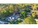 Aerial view of the home showcasing the landscaped yard and neighborhood at 8869 Sw 194Th Ct, Dunnellon, FL 34432