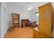 Cozy bedroom featuring hardwood floors, a desk, and built-in bookshelves at 8869 Sw 194Th Ct, Dunnellon, FL 34432