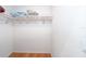 Empty walk-in closet with hardwood floors and a single shelf for storage at 8869 Sw 194Th Ct, Dunnellon, FL 34432