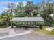 Community picnic shelter with tables, trash receptacles and a path overlooking the river at 8869 Sw 194Th Ct, Dunnellon, FL 34432