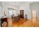 Formal dining room with hardwood floors, a chandelier, and views of the open-concept living area at 8869 Sw 194Th Ct, Dunnellon, FL 34432