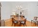 Dining room featuring a chandelier, hardwood floors, and open layout at 8869 Sw 194Th Ct, Dunnellon, FL 34432
