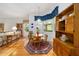 The dining room has natural light and flows into the living room and library at 8869 Sw 194Th Ct, Dunnellon, FL 34432