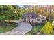 Charming home boasts a well-manicured lawn, mature trees, and a circular driveway at 8869 Sw 194Th Ct, Dunnellon, FL 34432