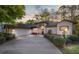 Inviting single-story home with a well-manicured lawn, a two-car garage, and ample parking space on the driveway at 8869 Sw 194Th Ct, Dunnellon, FL 34432