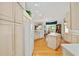 The bright kitchen has an island and a view into the dining and living rooms at 8869 Sw 194Th Ct, Dunnellon, FL 34432