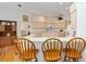 A neutral kitchen offers ample counter space and breakfast bar seating at 8869 Sw 194Th Ct, Dunnellon, FL 34432