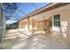 Spacious screened in lanai with ceiling fans offering an ideal space for outdoor living and entertaining at 8869 Sw 194Th Ct, Dunnellon, FL 34432