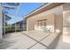 Spacious screened patio featuring a ceiling fan and outdoor seating at 8869 Sw 194Th Ct, Dunnellon, FL 34432