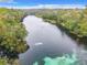 High angle view of a river flowing through a lush, green landscape at 8869 Sw 194Th Ct, Dunnellon, FL 34432